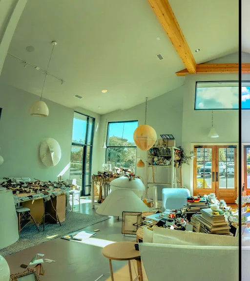 Before — Real Estate Listing: Showroom, Merchandise piled, Surface clutter.