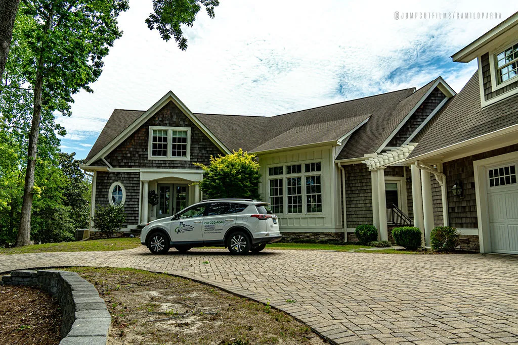 K's Cleaning Solutions van parked at a Jacksonville home — on-site service
