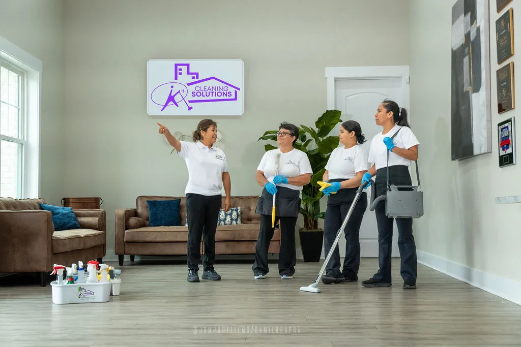 K's Cleaning Solutions team posing together — full crew shot